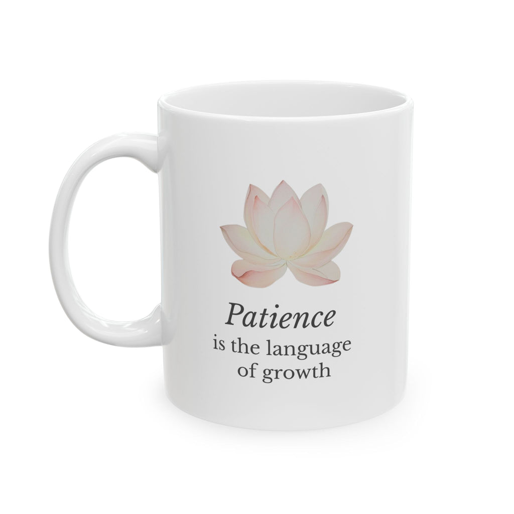 White mug with a pink lotus flower and motivational quote on a white background