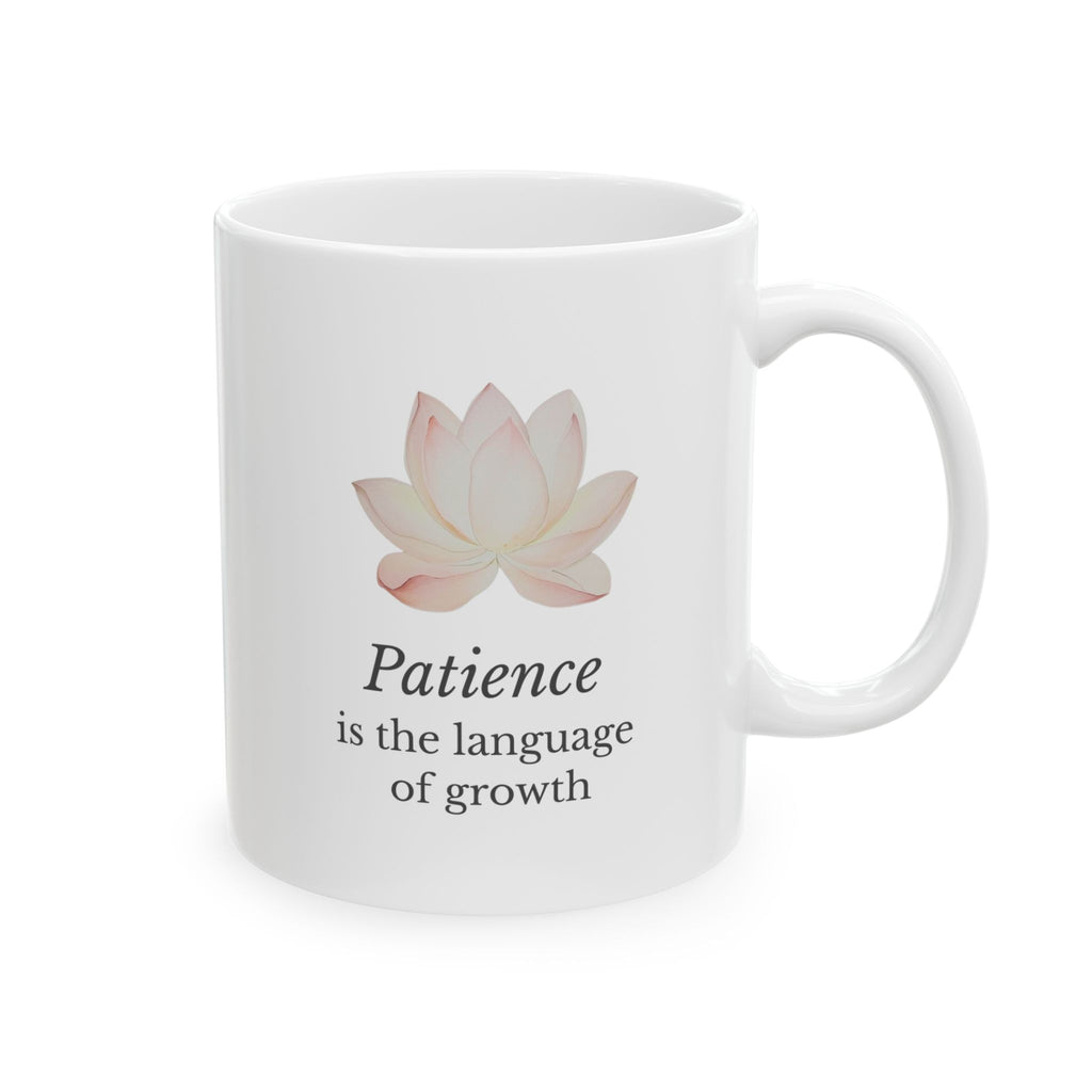 White ceramic mug with a lotus flower and motivational quote on a white background