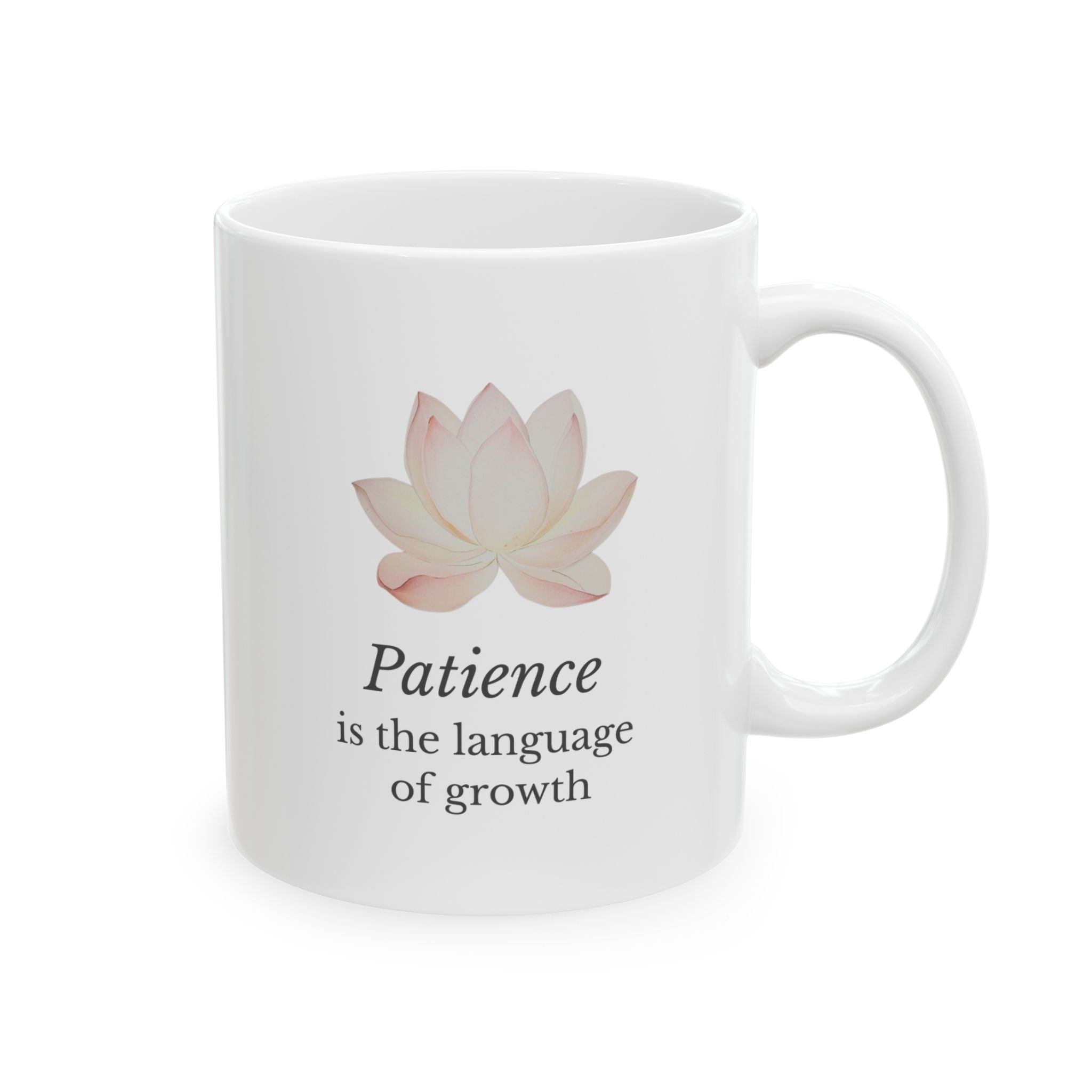 White ceramic mug with a lotus flower and motivational quote on a white background