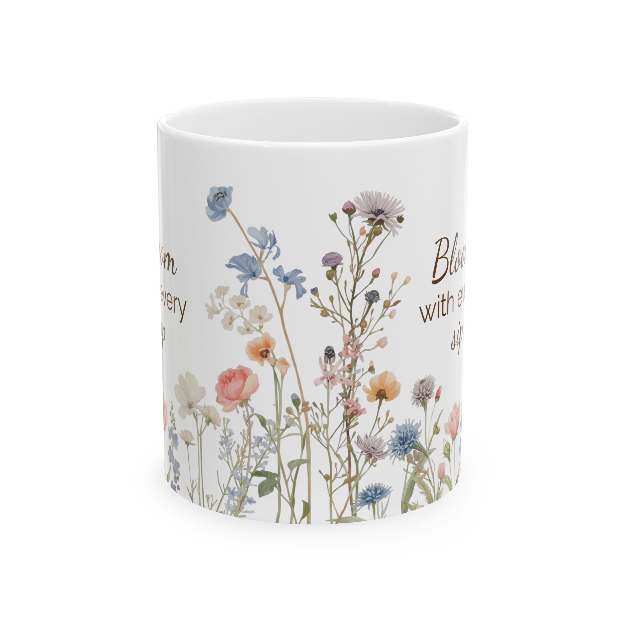 White mug with floral design and text on a white background