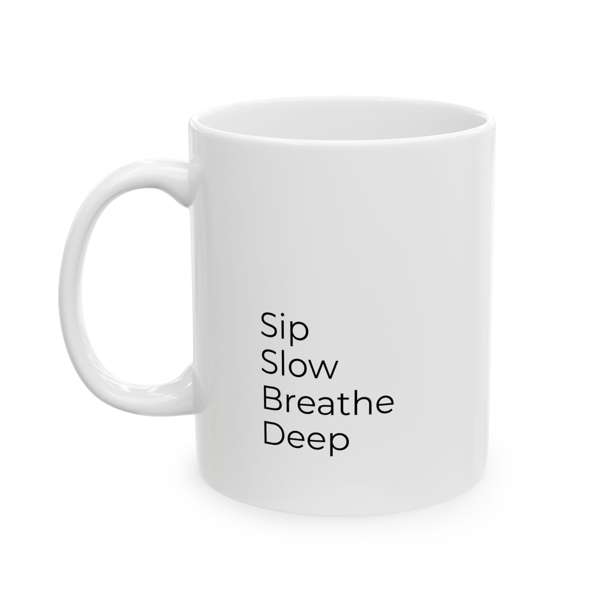 White mug with 'Sip Slow Breathe Deep' text on a white background