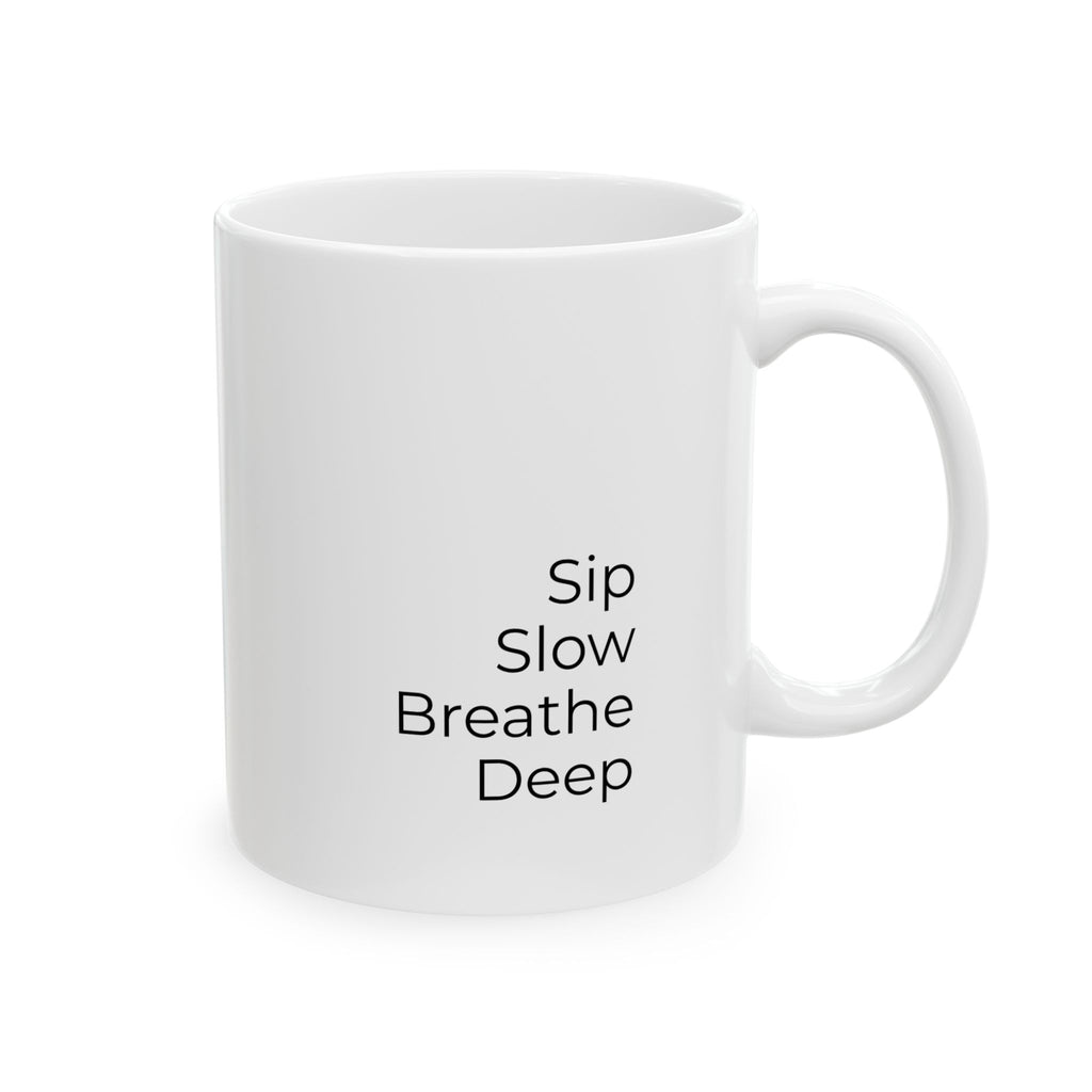 White mug with 'Sip Slow Breathe Deep' text on a white background